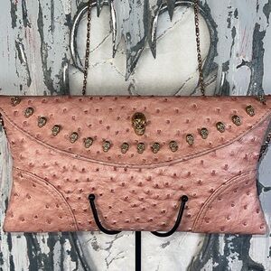 Skull clutch style crossbody bag.